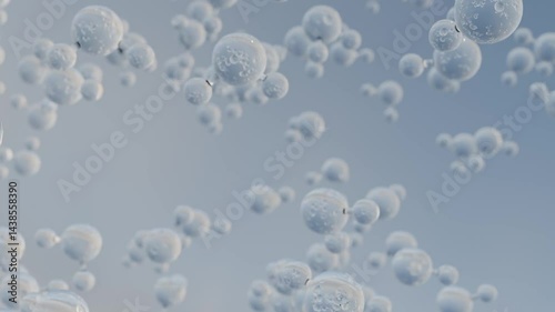 Water molecules rising in front of blue background. Floating H2O droplets seamless loop.