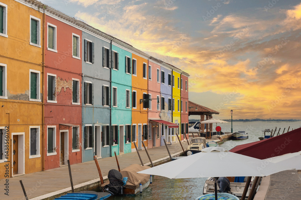 Obraz premium Colorful houses and boats in Burano Italy at sunset