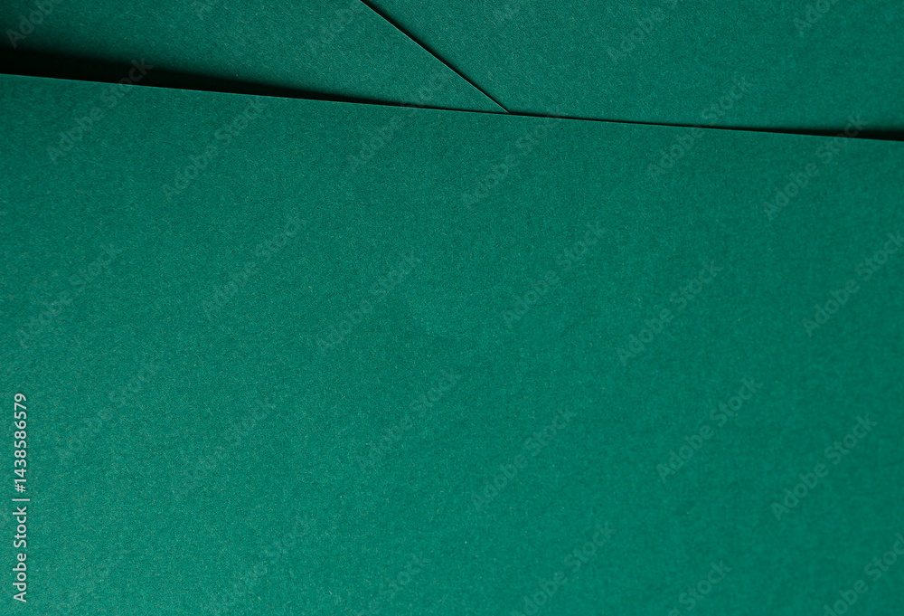 Fototapeta premium Matte paper texture with vibrant emerald and jewel green tones, sleek geometric lines and minimalistic design, offering a clean, smooth surface and premium finish, creating an elegant, modern backdrop
