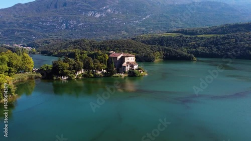 aerial view of a mansion near a lake