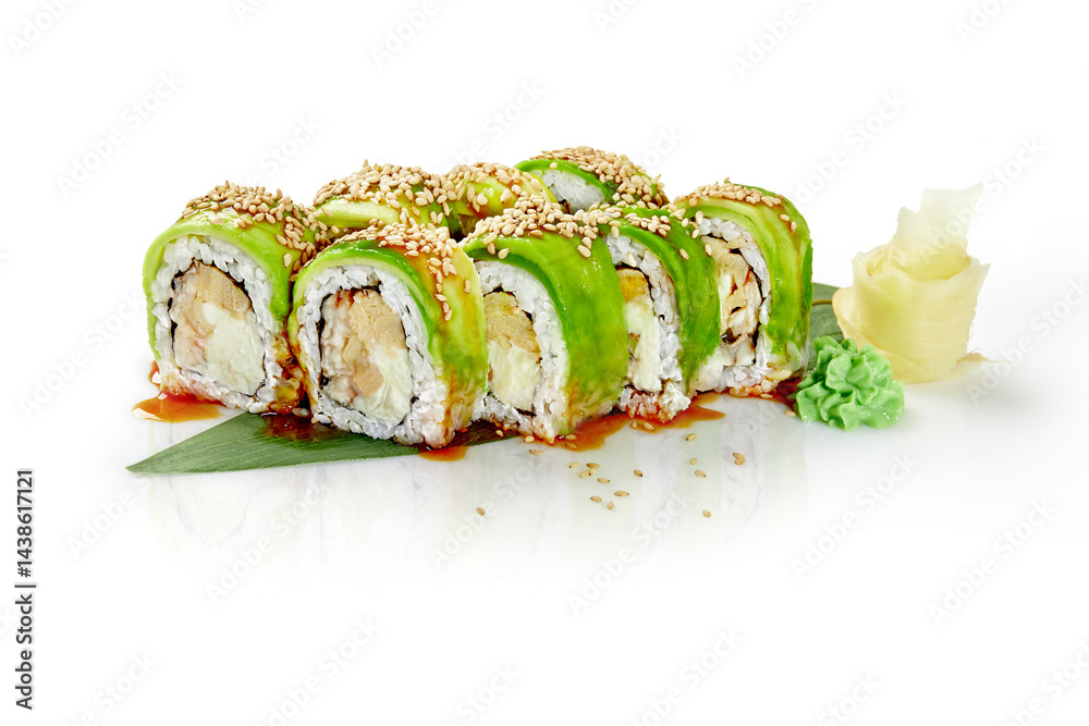 Green dragon sushi rolls with avocado, sesame seeds, and unagi sauce on white background