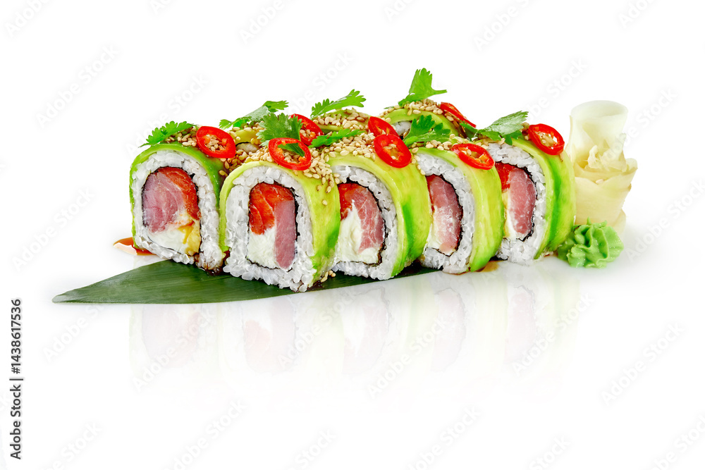 Green dragon sushi rolls with salmon, avocado and red pepper flakes on white background