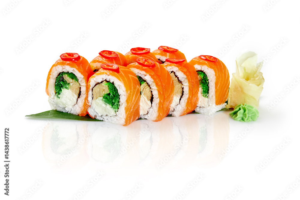Philadelphia uramaki sushi rolls with salmon, cream cheese, and cucumber garnished with chili pepper on white background