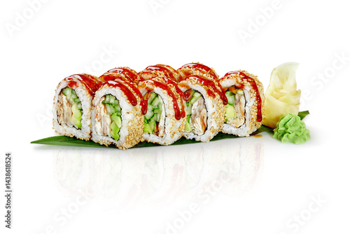 Obraz na płótnie Sushi rolls with sesame seeds, unagi sauce, cucumber, avocado and fish on banana leaf resting on white background w salonie
