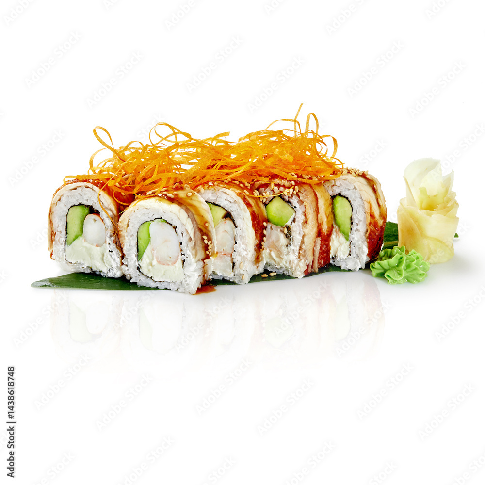 Dragon roll sushi with eel, shrimp, avocado, cream cheese, and sesame seeds displayed on banana leaf