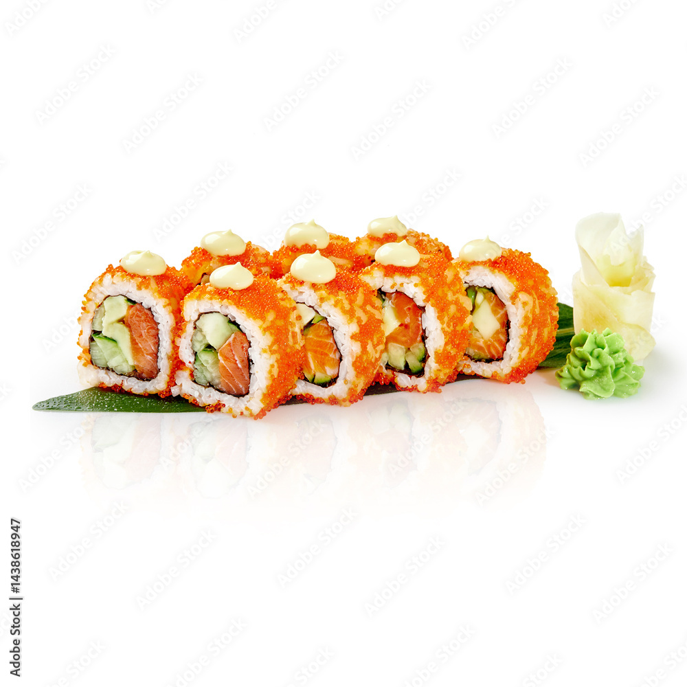 California roll covered in tobiko with salmon, avocado and cucumber filling resting on a bamboo leaf
