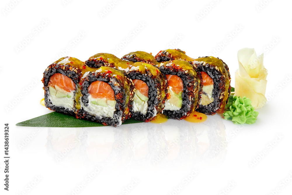 Black rice sushi roll filled with salmon and avocado, covered with mango sauce