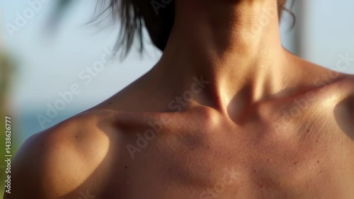 Wallpaper Mural Beautiful woman with glistening collarbones relaxing by the ocean on a sunny summer day with palm trees in the background Torontodigital.ca