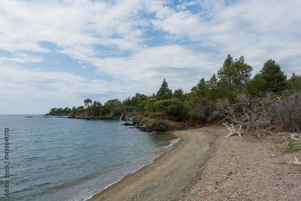 Beautiful scenery by the sea under a cloudy sky in Sithonia, Chalkidiki, Greece