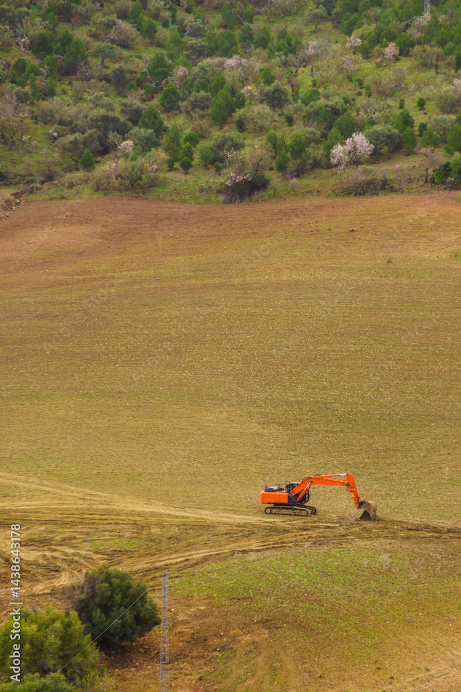 Digger excavator on field.