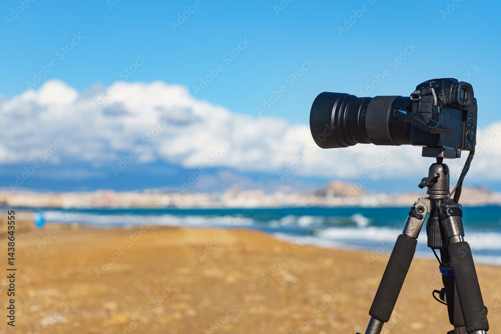 Camera taking picture of sea coast landscape