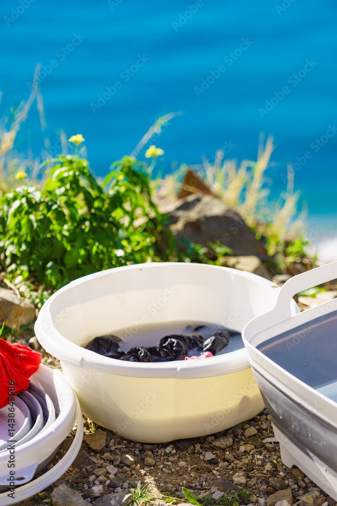 Washing laundry on holidays trip.