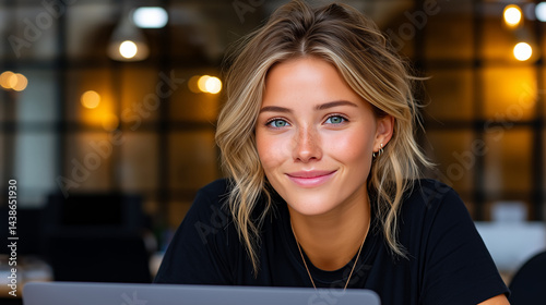 businesswoman smiling - with laptop