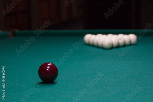 Russian billiards:  red and white balls on green game table