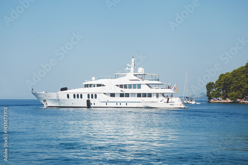 Obraz na płótnie Enjoy a luxurious yacht sailing experience in the tranquil and serene waters of the ocean w salonie