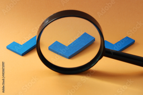 Magnifying glass selecting one of three check marks