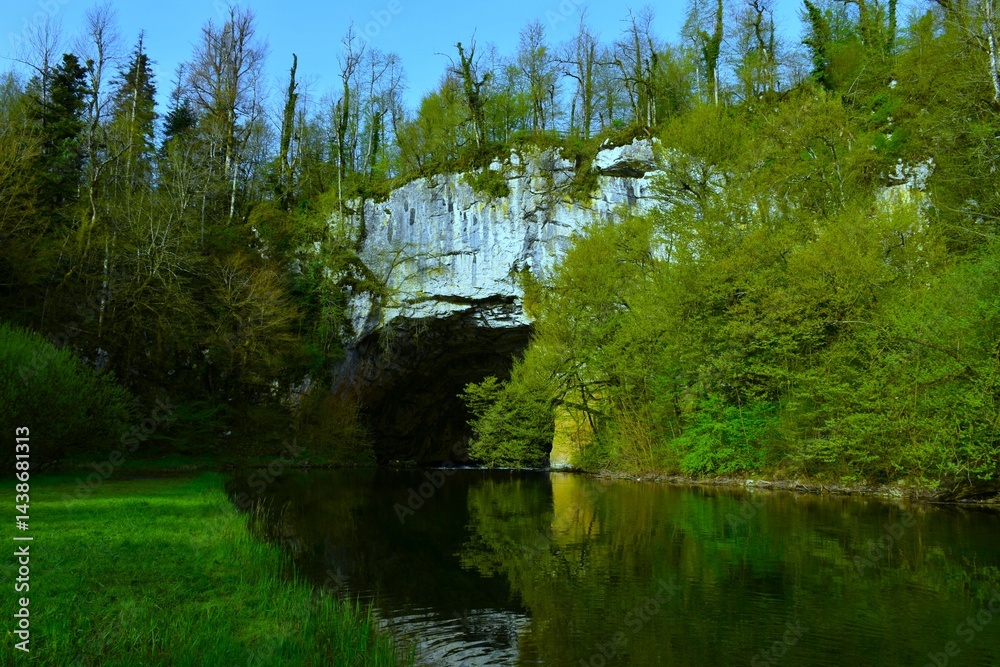 Rak river flowing under the big natural bridge karst rock formation in Rakov škocjan, Notranjska, Slovenia