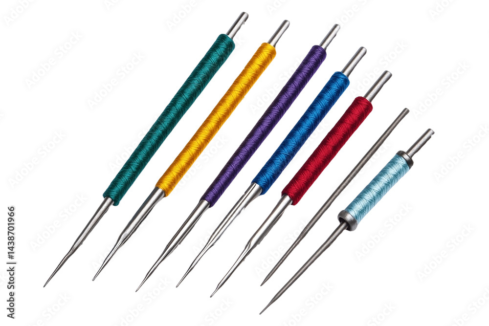 Thread rolls in various colors with needles.