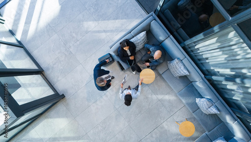 Foto Meeting, teamwork and business people in office lobby for corporate payroll planning from above