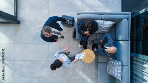 Business people, above and meeting in building with collaboration, financial pitch with document for strategy. Airport, tax accountant and table teamwork with budget paper for economy in layover