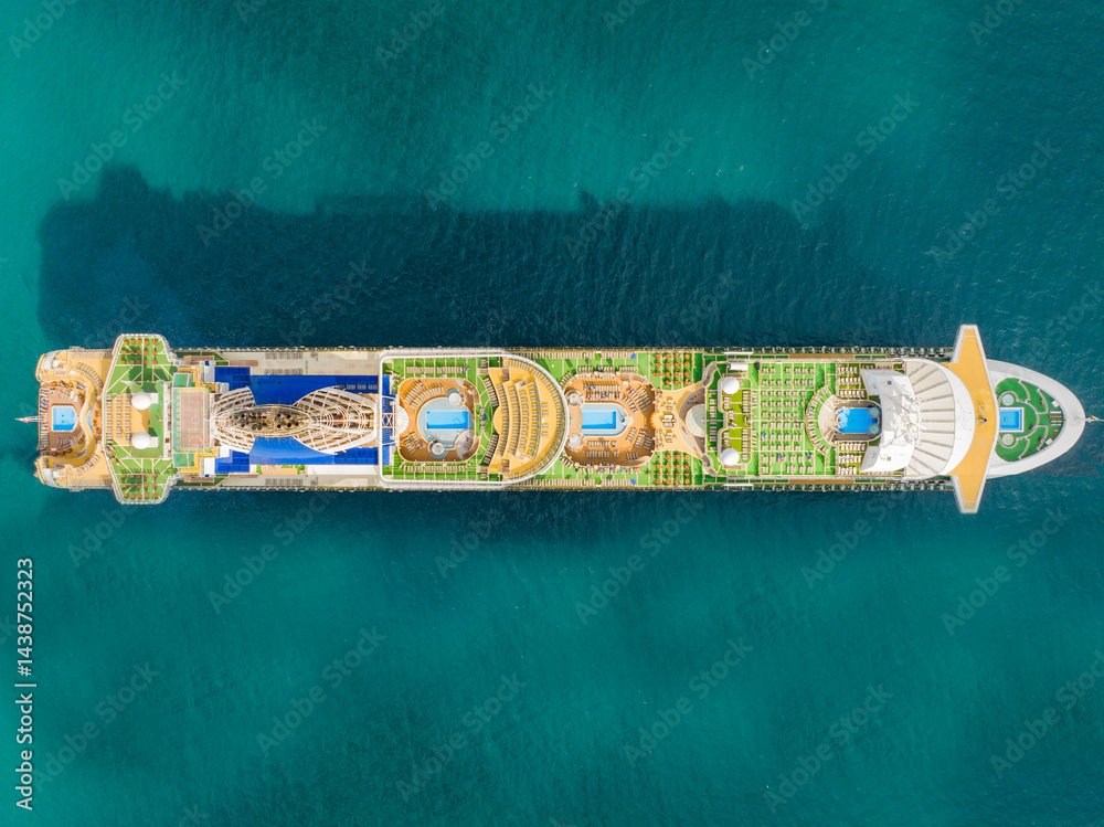 Luxurious cruise ship glides through turquoise waters offering stunning views and unforgettable vacation experiences