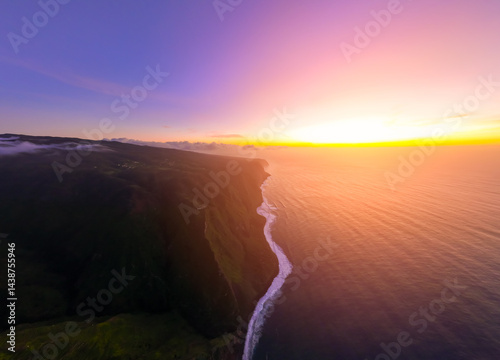 Obraz na płótnie Vibrant sunset illuminates the rugged coastline and vast ocean waters at twilight, showcasing natures breathtaking beauty in a tranquil setting w salonie