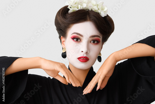 Beautiful young geisha on w...