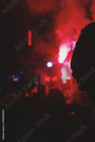 Night political protest outside red lights