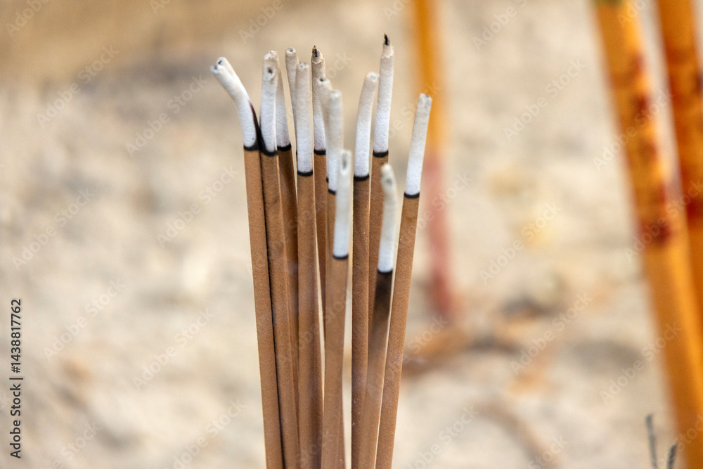 Burning joss stick inside Chinese temple.