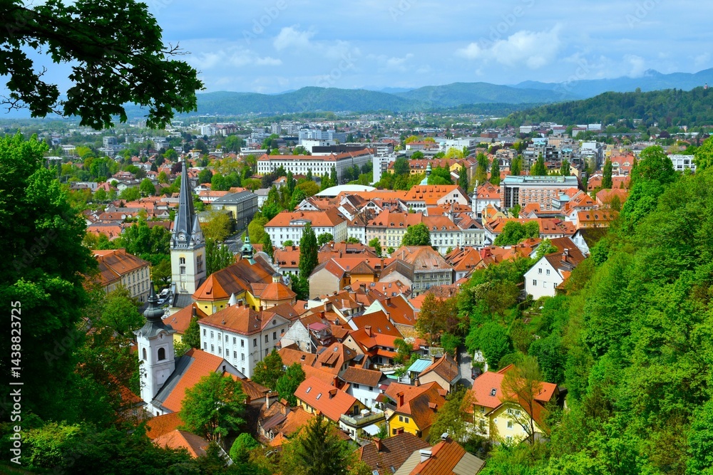 View of the old town of Ljubljana with church towers and red roofs in Slovenia