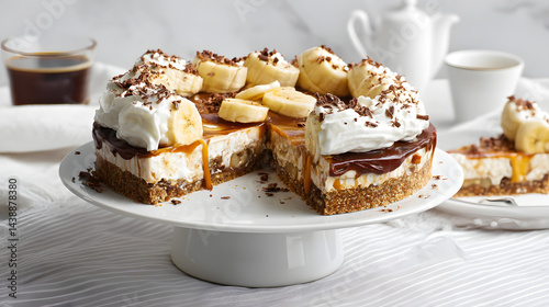 Wallpaper Mural Decadent Banoffee Pie with Layers of Cream, Banana, and Buttery Biscuit Base Served on a White Plate Torontodigital.ca