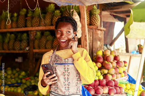 immersed image of stall market woman connecting a mobile phone to earpod