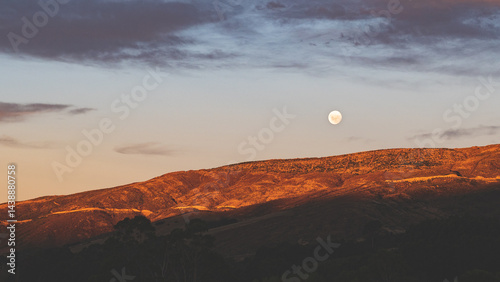 Beautiful sunrise and moonset on the hills in otago new zealand golden hour colours stunning