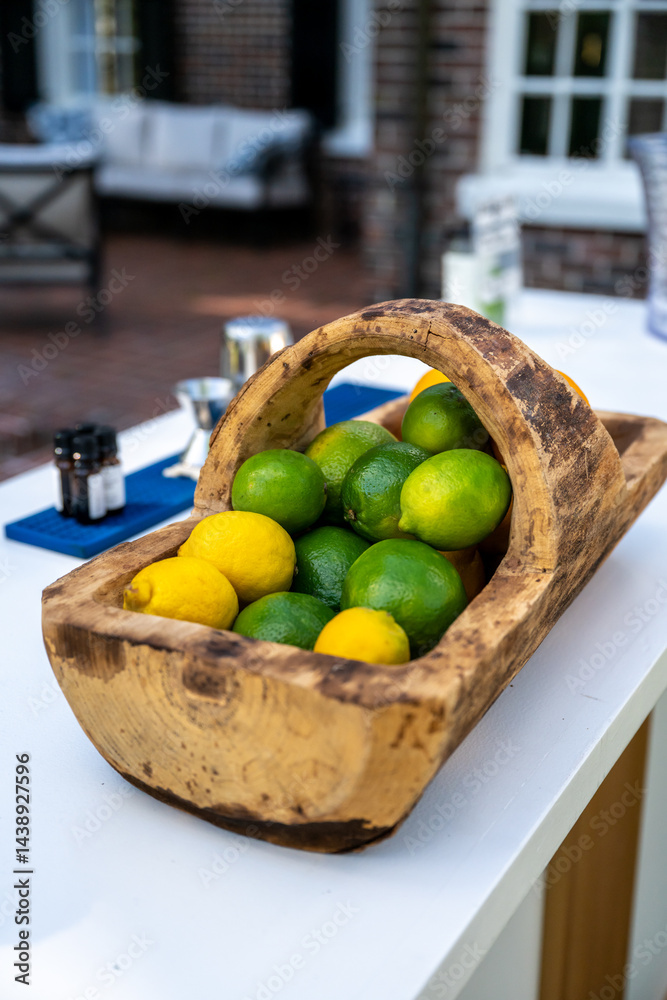 Lemons and Limes In Wooden Basket