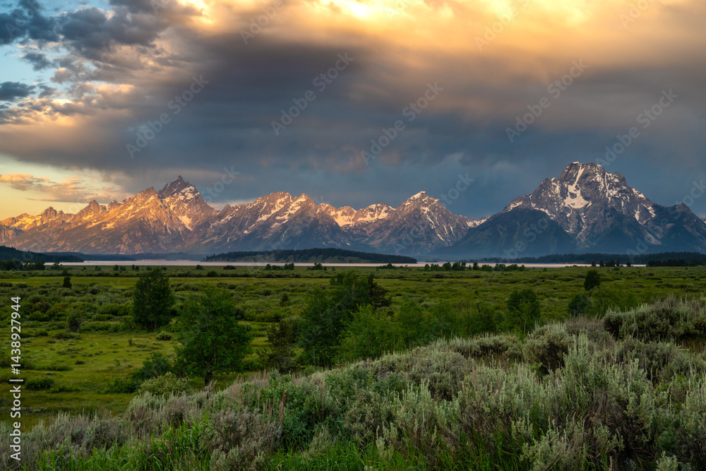 Light Glows on Edge of Grand Teton Range at Sunrise