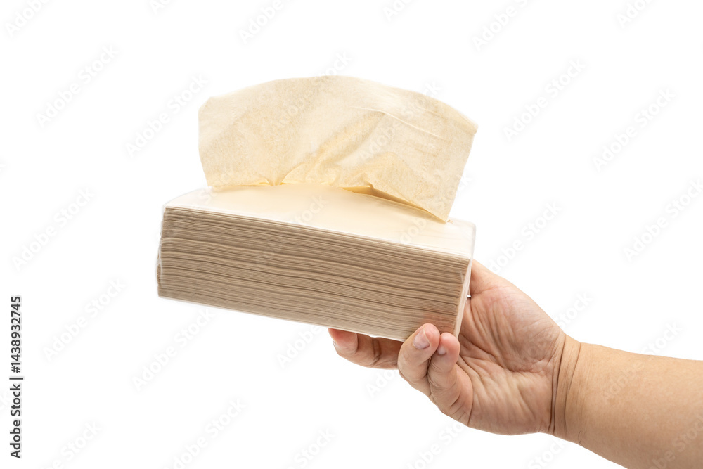 Hand holding Brown tissue paper pack isolated on white background.