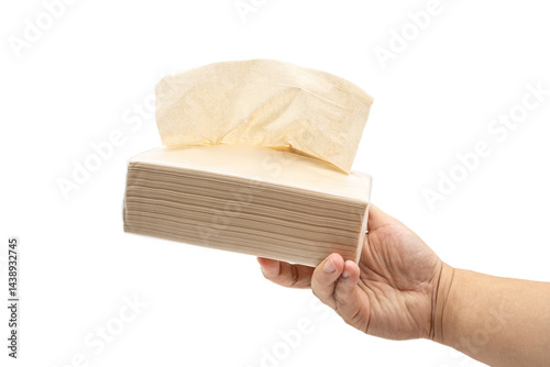 Obraz na płótnie Hand holding Brown tissue paper pack isolated on white background. w salonie