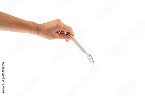 Hand and metal white spoon on transparent background.