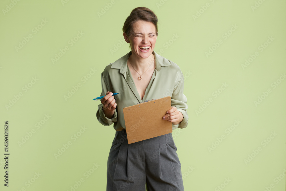 Laughing woman with clipboard