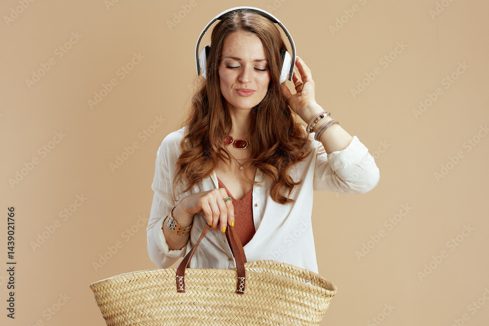 relaxed elegant woman in blouse and shorts on beige