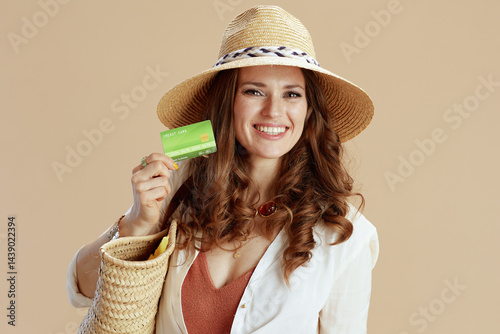Obraz na płótnie happy elegant woman in blouse and shorts isolated on beige w salonie