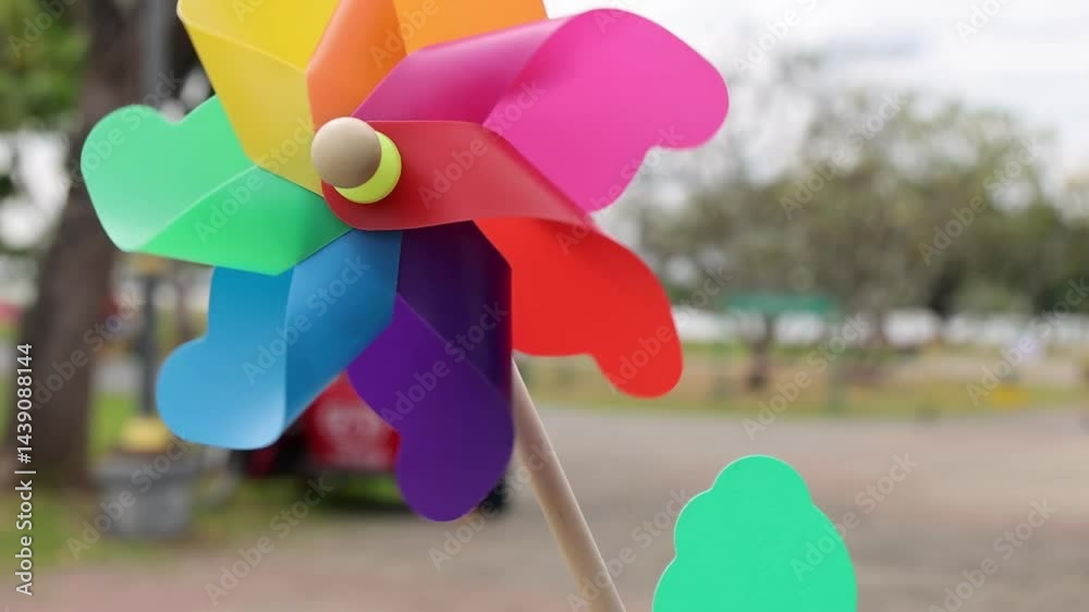 Vibrant Pinwheel Spins in Outdoor Setting