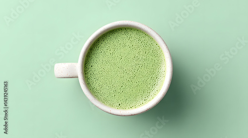 Obraz na płótnie Top-down close-up photo of a perfectly made matcha latte.
w salonie