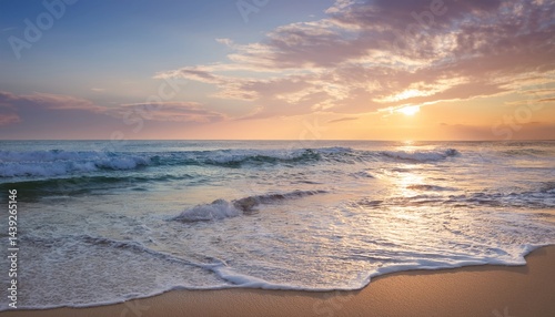 A beautiful beach at sunset with gentle waves and a colorful sky.