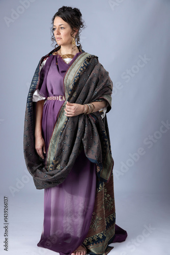 фотографія A Roman noble woman wearing a white tunic with a purple silk stola over the top
