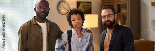 Header of psychologist standing next to schoolboy with broken nose and his father while everyone looking at camera