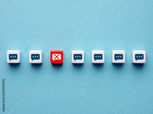 Censorship and free speech concept. Speech bubbles on cubes with one of them is banned.