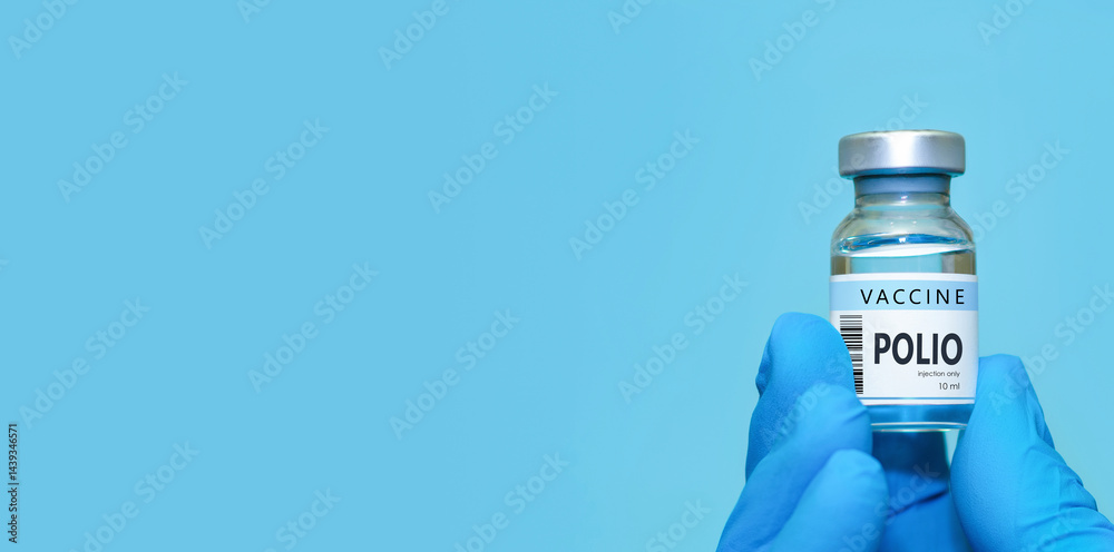 Doctor in protective medical gloves holding a Polio vaccine bottle, representing modern healthcare, immunization awareness, antiviral disease prevention, scientific research,vaccination safety