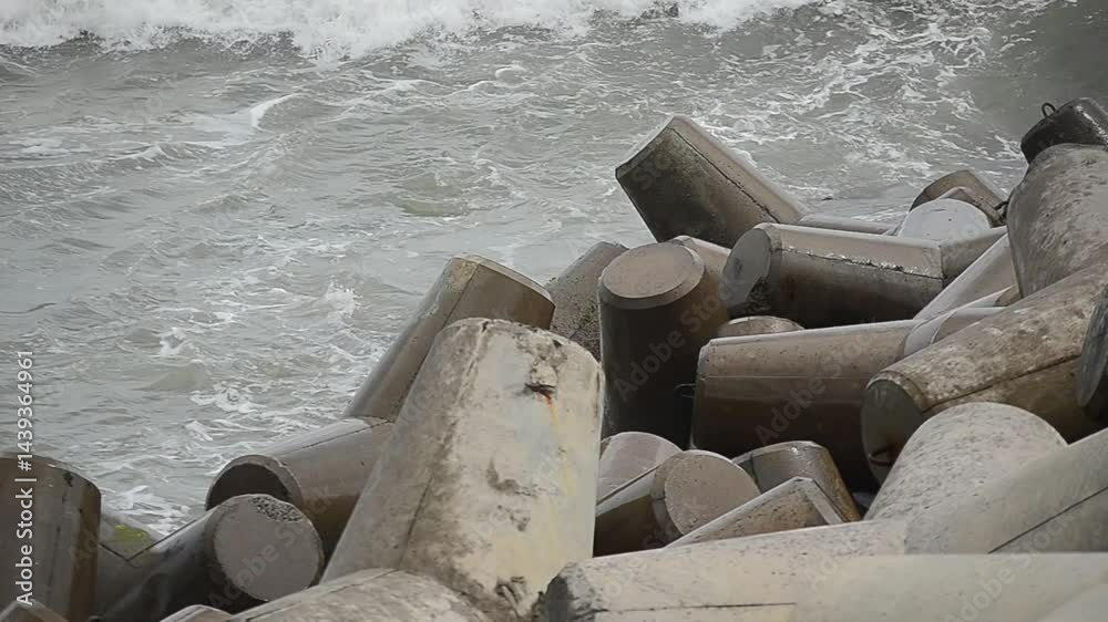 heavy waves hit tetrapods