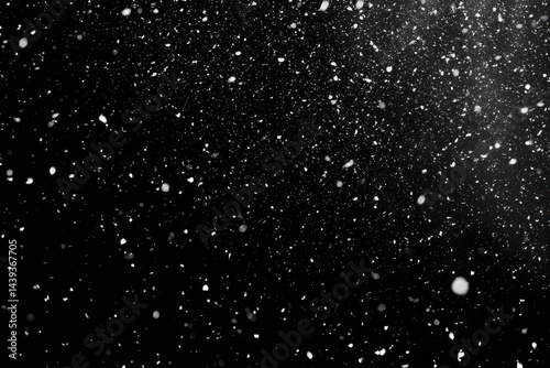 Snowflakes falling on black background